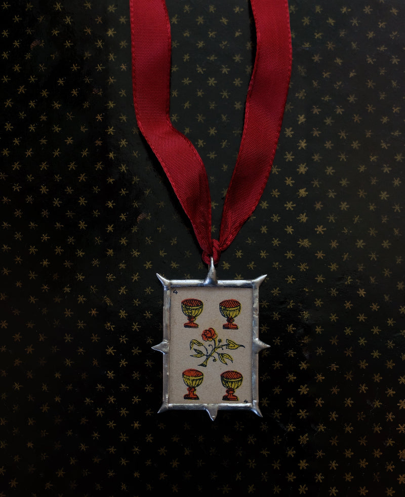 Four cups and a rose